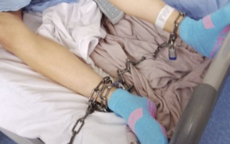POLICE CHAIN ABORIGINAL TEENAGE MOTHER TO HOSPITAL BED